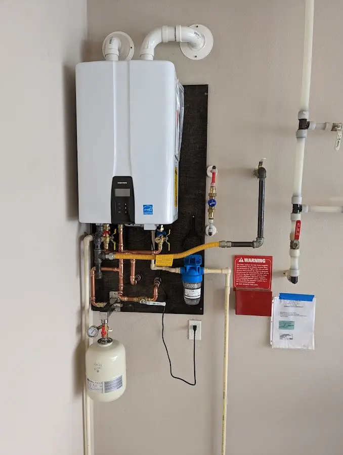 Professional plumber installing copper piping in a Lake Morton-Berrydale home